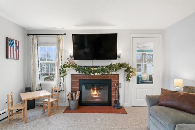 carpeted living room with a fireplace