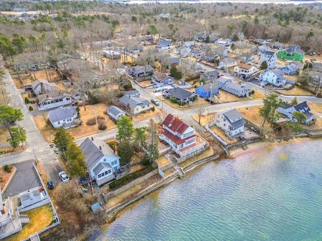 birds eye view of property with a residential view and a water view