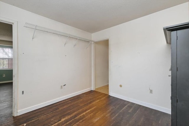 spare room with dark hardwood / wood-style flooring