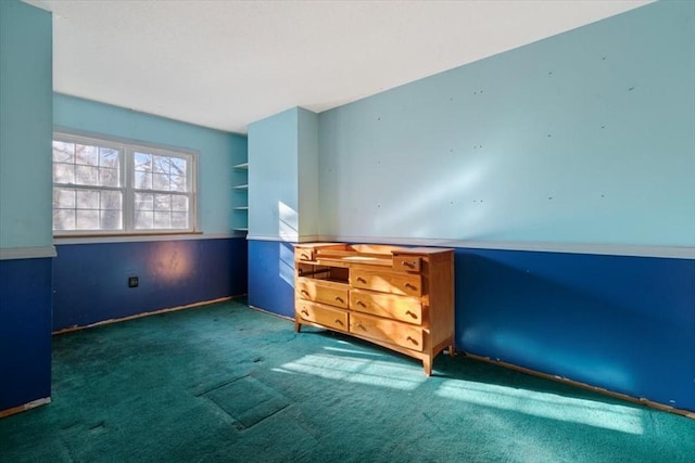 unfurnished bedroom featuring dark colored carpet