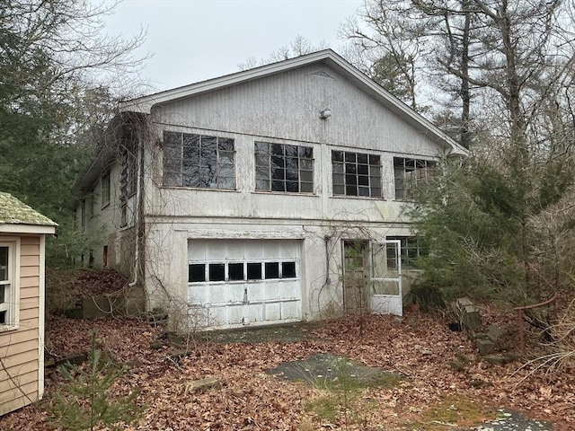 view of side of home featuring a garage