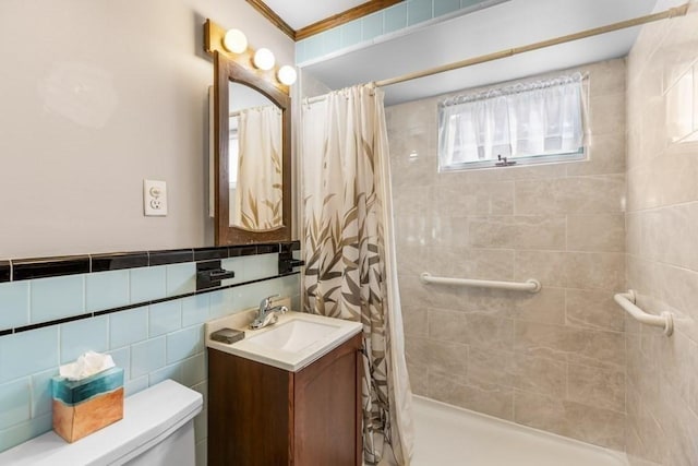 bathroom with tile walls, vanity, ornamental molding, toilet, and a shower with shower curtain