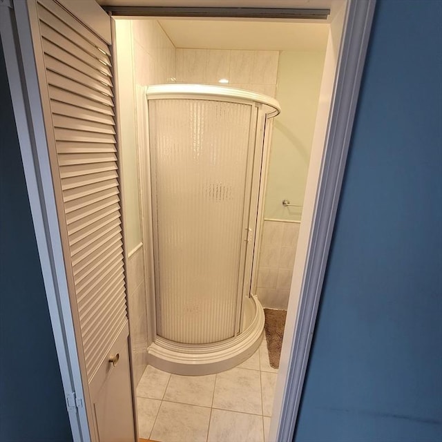 bathroom featuring tile patterned floors and walk in shower