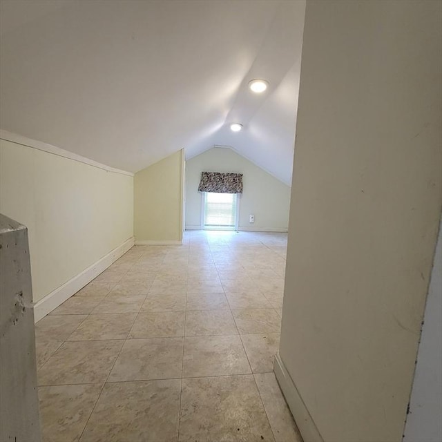 additional living space with lofted ceiling