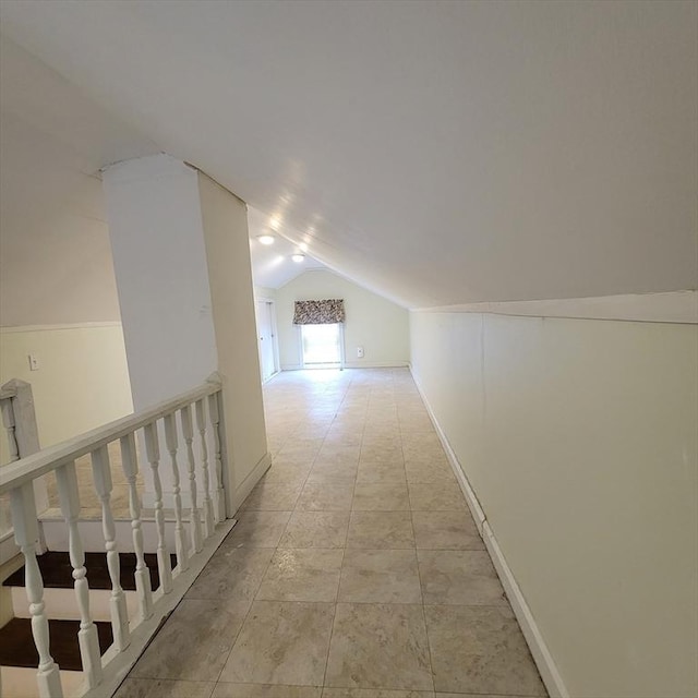 corridor with vaulted ceiling