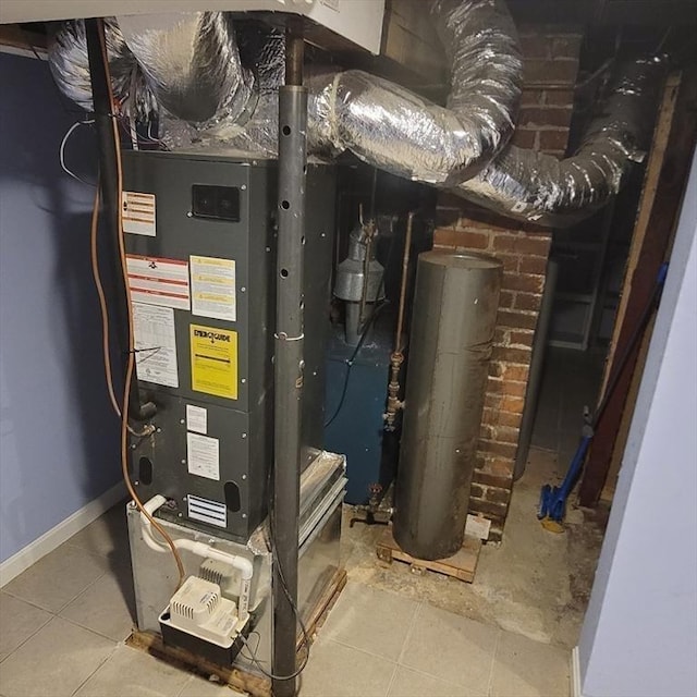 utility room featuring water heater