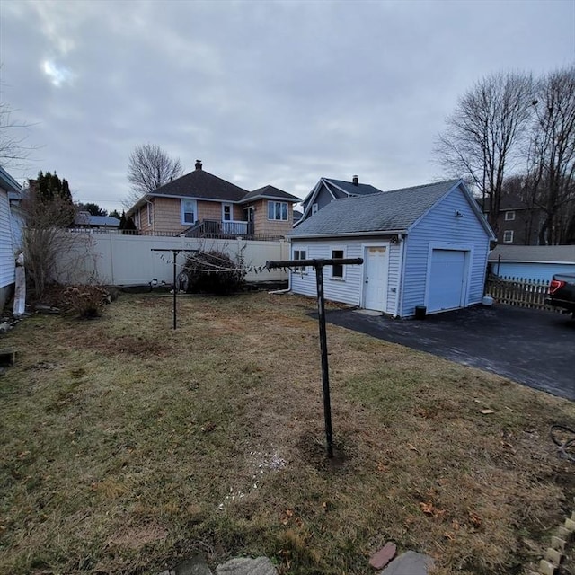 view of yard featuring an outbuilding and a garage