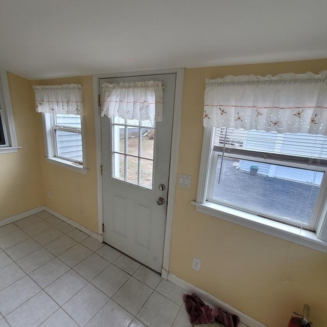 entryway featuring light tile patterned floors