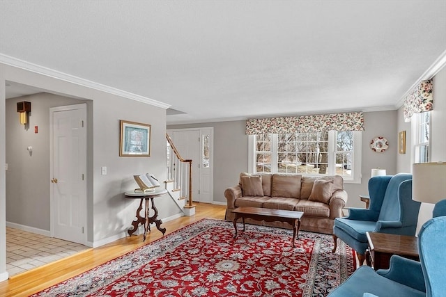 living room with ornamental molding and light wood-type flooring