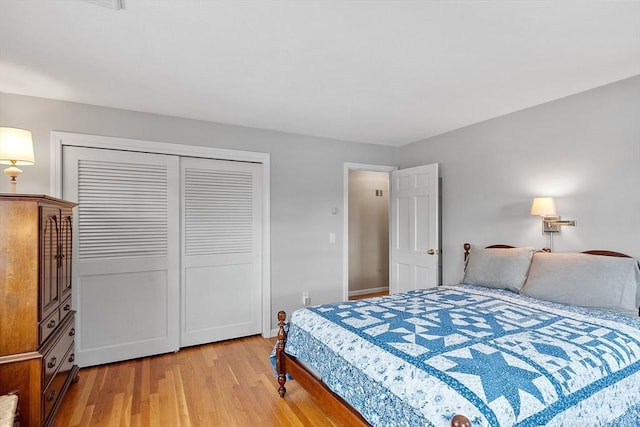 bedroom featuring a closet and light wood-type flooring