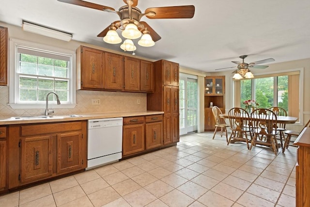 112 Stoddard Dr, North Attleboro, MA 02760 - kitchen with white dishwasher, a sink, a ceiling fan, and tasteful backsplash
