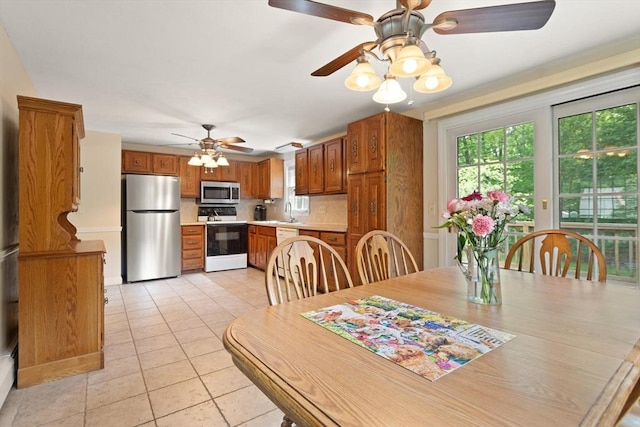 112 Stoddard Dr, North Attleboro, MA 02760 - dining area with ceiling fan and light tile patterned flooring