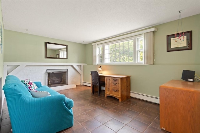 112 Stoddard Dr, North Attleboro, MA 02760 - office with baseboard heating, a brick fireplace, tile patterned floors, and a textured ceiling