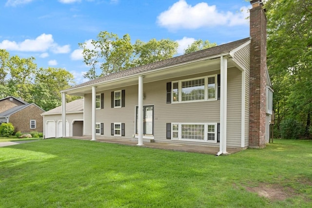 112 Stoddard Dr, North Attleboro, MA 02760 - view of front of property with a chimney, a front lawn, an attached garage, and driveway