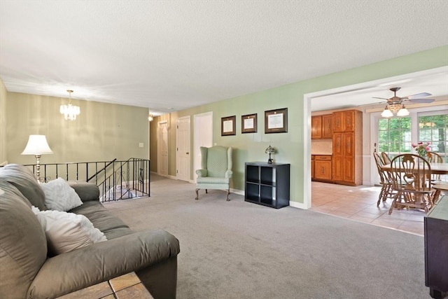 112 Stoddard Dr, North Attleboro, MA 02760 - living room featuring a chandelier, ceiling fan, light colored carpet, and a textured ceiling