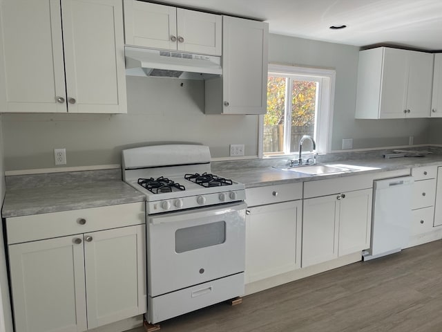 kitchen featuring range hood, sink, hardwood / wood-style flooring, white cabinets, and white appliances