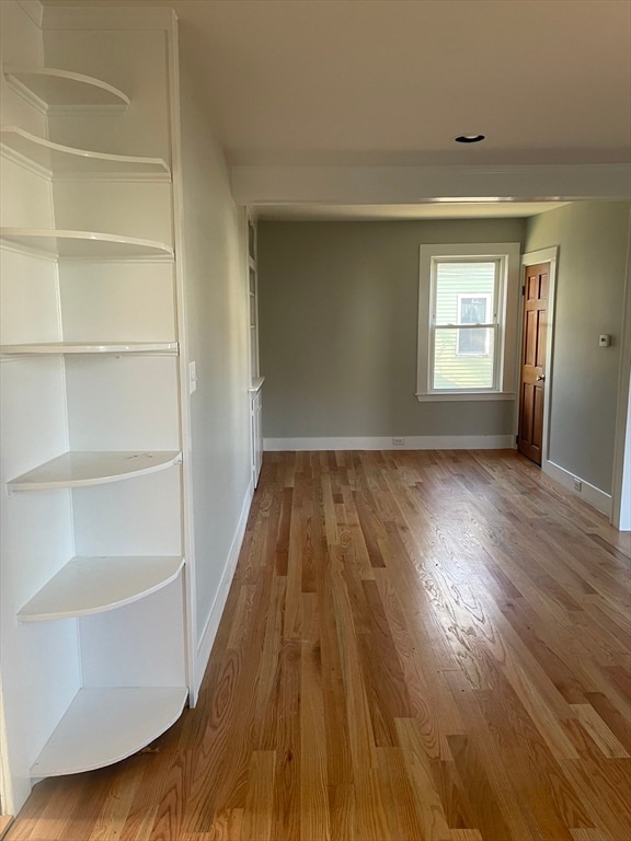 hallway featuring hardwood / wood-style floors