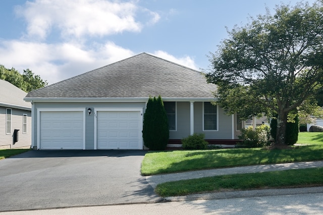 view of front facade featuring a garage and a front lawn