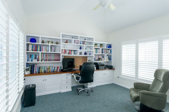 office area with lofted ceiling, dark colored carpet, and ceiling fan