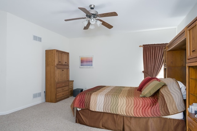 bedroom featuring light carpet and ceiling fan