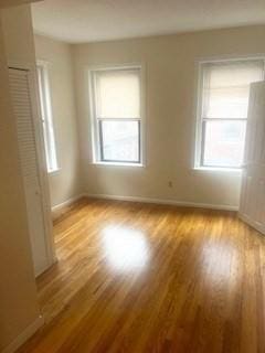 spare room with light wood-type flooring