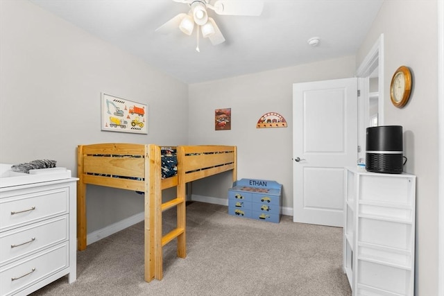 bedroom featuring baseboards, ceiling fan, and light colored carpet