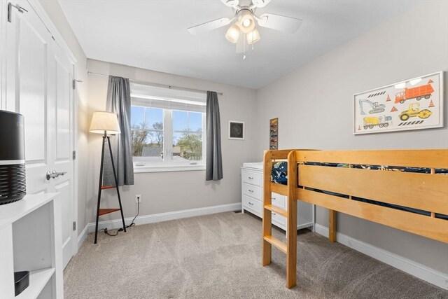 bedroom with carpet floors, a ceiling fan, and baseboards