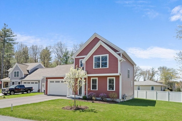 view of front of home featuring a garage, a front lawn, aphalt driveway, and fence