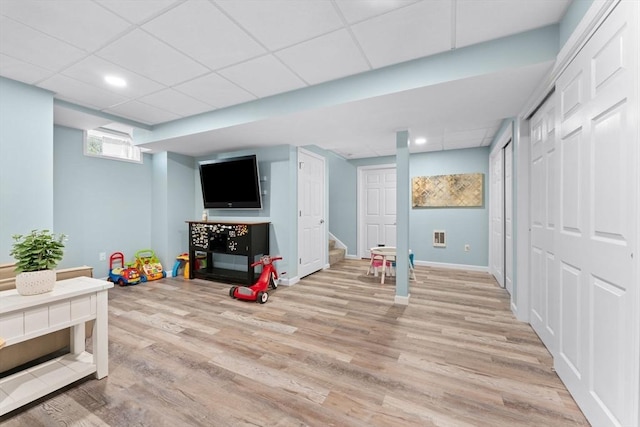 game room featuring a paneled ceiling, visible vents, baseboards, light wood finished floors, and recessed lighting