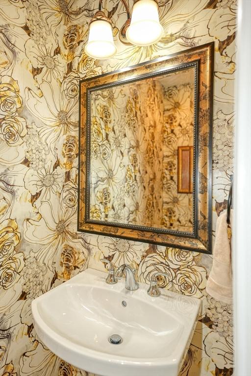 44 Stevens Rd Unit 44, Hudson, MA 01749 - bathroom with a sink and wallpapered walls