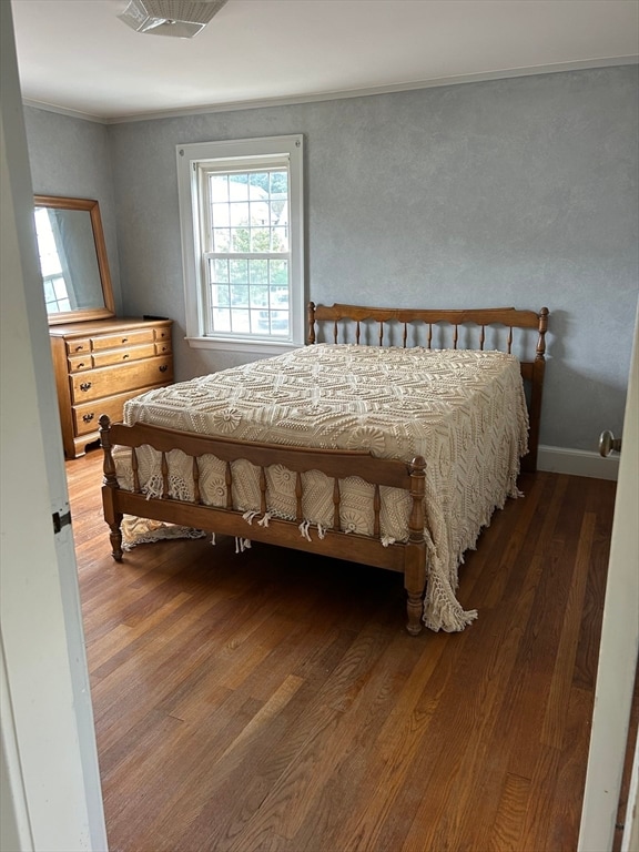 bedroom featuring dark hardwood / wood-style floors