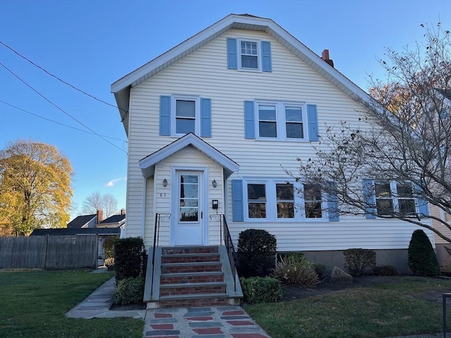 view of front of home with a front lawn