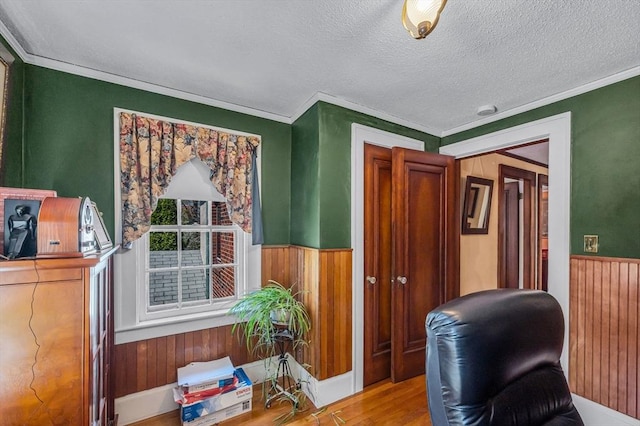 68 Ingersoll Grv, Springfield, MA 01109 - office area with wood walls, ornamental molding, wood finished floors, and a wainscoted wall