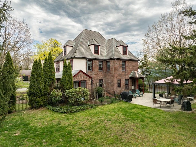 68 Ingersoll Grv, Springfield, MA 01109 - back of house with a gazebo, a lawn, fence, and a patio