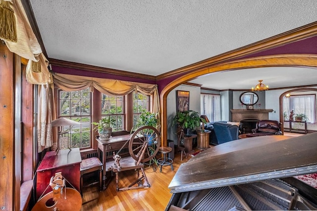 68 Ingersoll Grv, Springfield, MA 01109 - dining room featuring crown molding, arched walkways, and wood finished floors