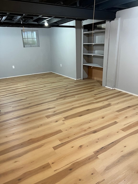 basement featuring light wood-type flooring