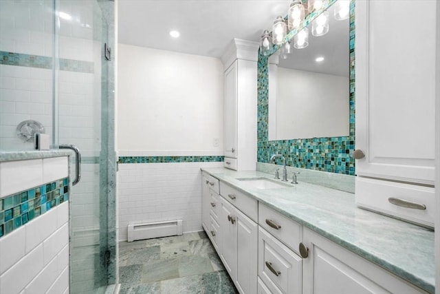 4 Cushing St, Hingham, MA 02043 - bathroom with baseboard heating, tile walls, vanity, a shower stall, and recessed lighting