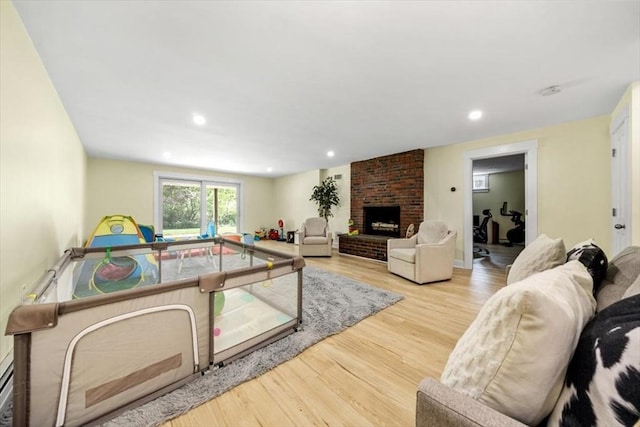 4 Cushing St, Hingham, MA 02043 - living area featuring wood finished floors, recessed lighting, and a brick fireplace