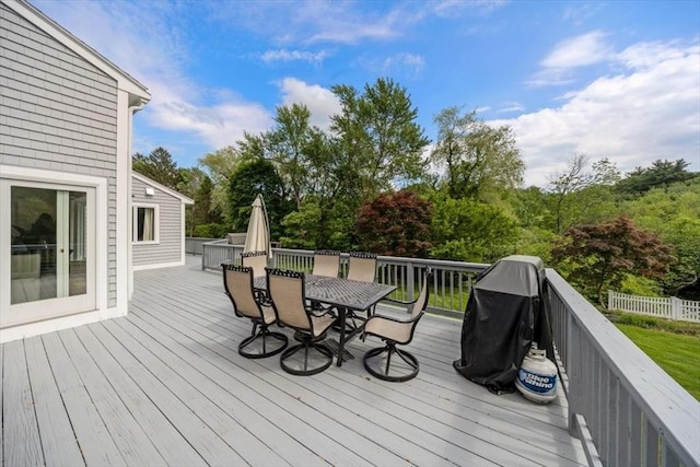 4 Cushing St, Hingham, MA 02043 - wooden terrace with outdoor dining area and view of wooded area