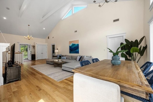 4 Cushing St, Hingham, MA 02043 - living room featuring a chandelier, high vaulted ceiling, light wood finished floors, and beamed ceiling