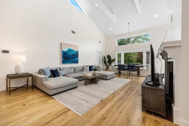4 Cushing St, Hingham, MA 02043 - living room with high vaulted ceiling, beam ceiling, and light wood-style flooring