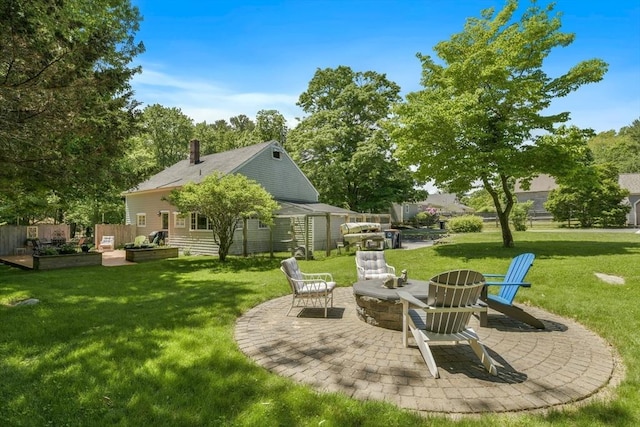 21 Norwell Ave, Norwell, MA 02061 - view of grassy yard featuring a fire pit, a patio, and a vegetable garden