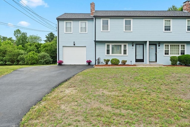 18 Buena Vis Unit 18, Franklin, MA 02038 - view of front of home with a chimney, asphalt driveway, a front lawn, and an attached garage