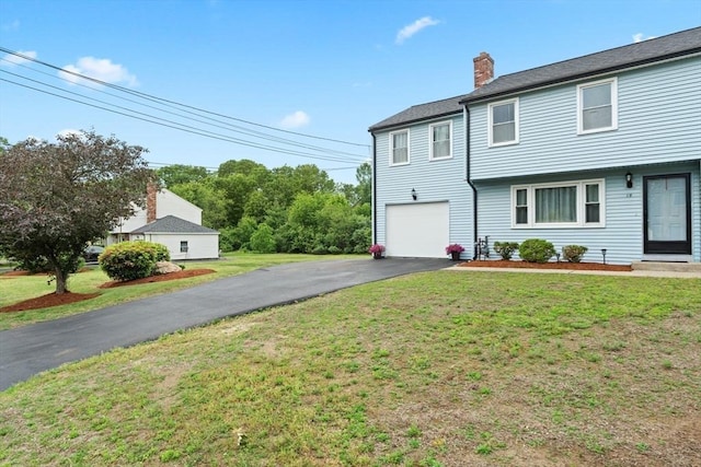 18 Buena Vis Unit 18, Franklin, MA 02038 - view of front facade with a chimney, driveway, a front lawn, and an attached garage