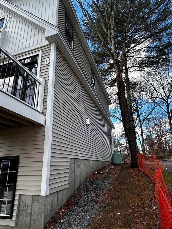 view of side of property with a balcony