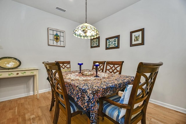 dining area with light hardwood / wood-style floors