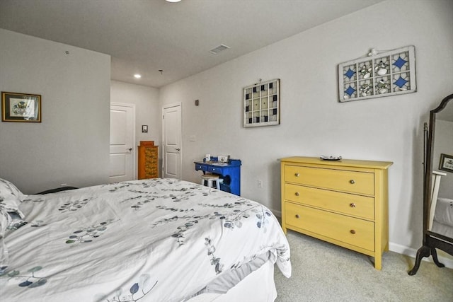 bedroom with light carpet