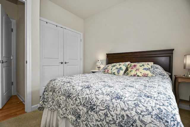 carpeted bedroom featuring a closet