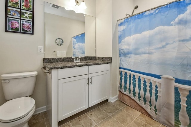 bathroom featuring vanity, toilet, and walk in shower