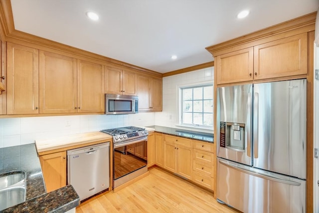 6 Hickorywood, Plymouth, MA 02360 - kitchen featuring appliances with stainless steel finishes, light wood-style flooring, decorative backsplash, light brown cabinetry, and recessed lighting